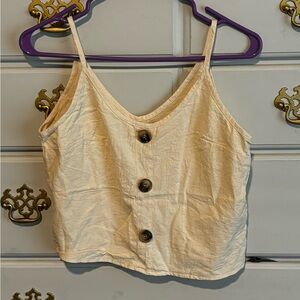 Size S cream crop top.